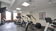 York apartment for rent - a gym with various exercise equipment in a room