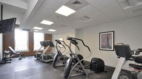 York apartment for rent - a gym with various exercise equipment in a room