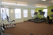 Elkton apartment for rent - a gym with some exercise equipment and windows