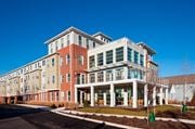 Elkton apartment for rent - a large building with a street in front of it