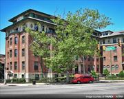 Jersey City apartment for rent - a red car parked in front of a brick building