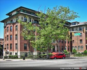 Jersey City apartment for rent - a red car parked in front of a brick building