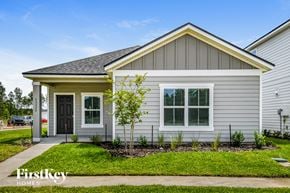 Yulee house for rent - the front of a white house with a tree in the front yard
