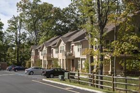 Cedar Knolls apartment for rent - a row of houses with cars parked in front of them