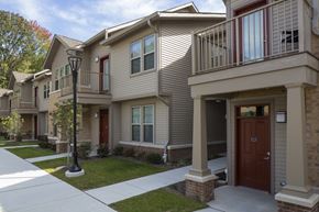 Cedar Knolls apartment for rent - a row of townhomes with a sidewalk and a street light