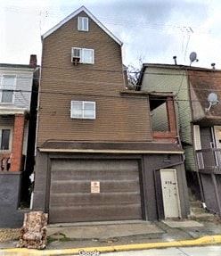 West Homestead apartment for rent - a brown house with a garage on a street
