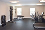 Pennington apartment for rent - a gym with various machines and weights on the floor