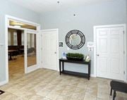 Newark apartment for rent - a lobby with two doors and a mirror on the wall