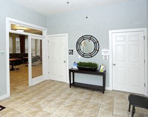 Newark apartment for rent - a lobby with two doors and a mirror on the wall