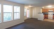 Manalapan apartment for rent - an empty living room with a kitchen and a window