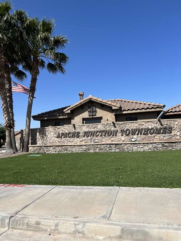 Apache Junction apartment for rent - A house with a sign that says Apache Junction Townhomes.