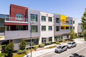 Palo Alto apartment for rent - a row of apartment buildings with cars parked in front of them