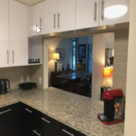 Palo Alto apartment for rent - a kitchen with a counter top looking into a living room