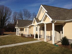 Wilmington apartment for rent - A row of houses with a clear blue sky above them.