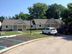 Wilmington apartment for rent - A white car is parked in front of a house.