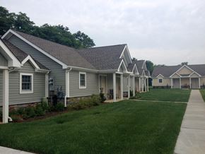 Wilmington apartment for rent - A row of houses with green lawns in front.