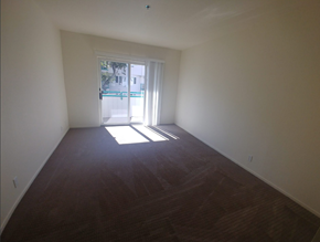 Palo Alto apartment for rent - an empty living room with a door to a swimming pool