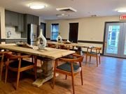 Avenel apartment for rent - a large dining room with wooden tables and chairs