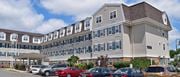 Avenel apartment for rent - a large apartment building with cars parked in front of it