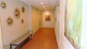 West New York apartment for rent - a hallway with a bench and a painting on the wall