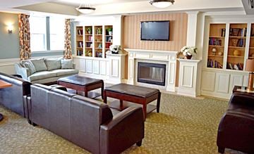 Perth Amboy apartment for rent - a living room filled with furniture and a fireplace