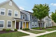 Pilesgrove apartment for rent - a row of townhomes with a tree in front of them