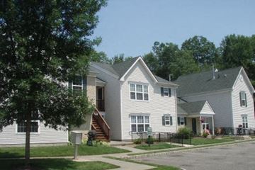 Landing townhouse for rent - a group of white houses on the side of a street