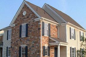 Mullica Hill apartment for rent - a large brick house with a brown roof