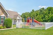 Mullica Hill apartment for rent - a playground in front of a house behind a white fence