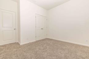 Lafayette apartment for rent - a bedroom with white walls and carpet and white doors