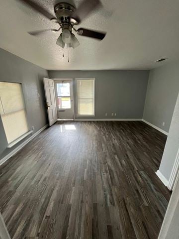 Killeen apartment for rent - A room with a ceiling fan and wood flooring.