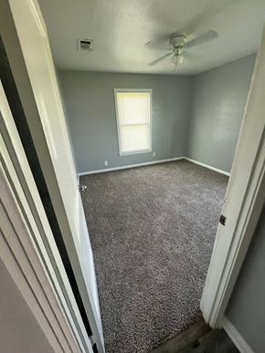 Killeen apartment for rent - A room with a carpeted floor and a window.