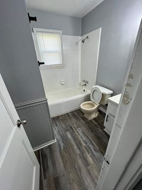 Killeen apartment for rent - A bathroom with a toilet, sink, and bathtub.