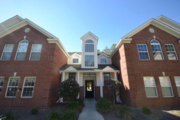 Florence apartment for rent - the front entrance of a brick building with a walkway