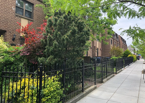 Washington apartment for rent - a sidewalk in front of a wrought iron fence