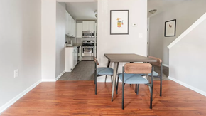 Washington apartment for rent - a dining room with a table and chairs and a kitchen