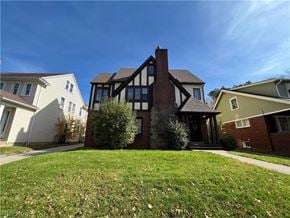 Shaker Heights apartment for rent - a view of a house with a yard in front of it