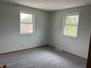 Canton apartment for rent - A room with two windows and carpeted floor.