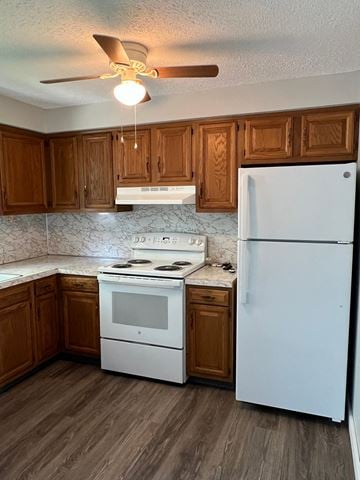 Canton apartment for rent - A kitchen with a white fridge, white stove and white oven.