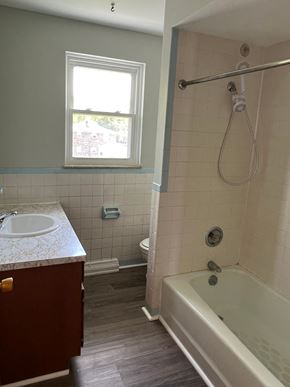 Canton apartment for rent - A white sink is on a marble countertop in a bathroom.