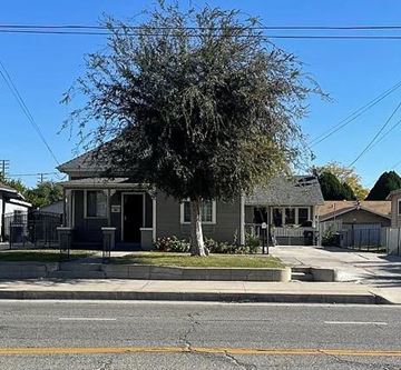 San Bernardino apartment for rent - a house on the corner of a street with a tree