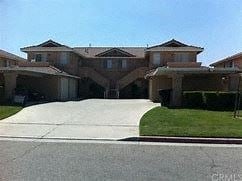 Hemet apartment for rent - a large house with a driveway in front of it