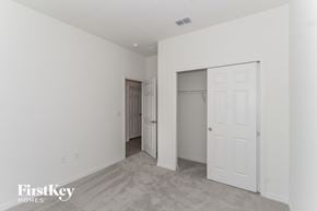 Bartow house for rent - A white bedroom with a door and a closet.
