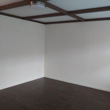N. Hollywood apartment for rent - an empty living room with white walls and wooden floors