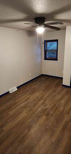 Windsor house for rent - A room with a ceiling fan and a window.