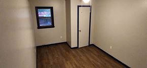 Windsor house for rent - A room with a door and a window.
