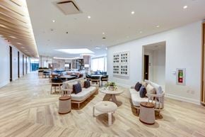 Long Beach apartment for rent - a living room with couches and tables and chairs