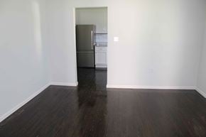 Petal house for rent - a living room with a hard wood floor and a refrigerator