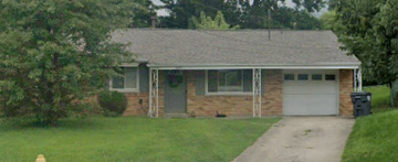 Cincinnati house for rent - A house with a grey garage door and a grey roof.