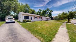 Cincinnati house for rent - a white mobile home sitting on the side of a street
